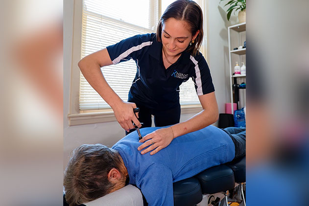 A woman receiving a relaxing massage from a professional male therapist