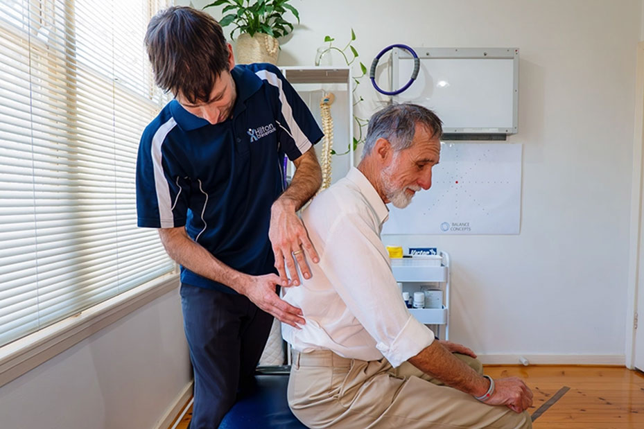 A man receiving physical therapy, focusing on rehabilitation
