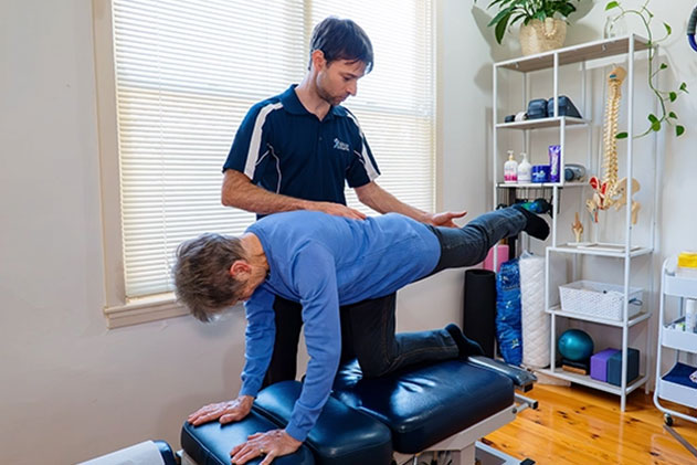 A man performs a physical therapy exercise